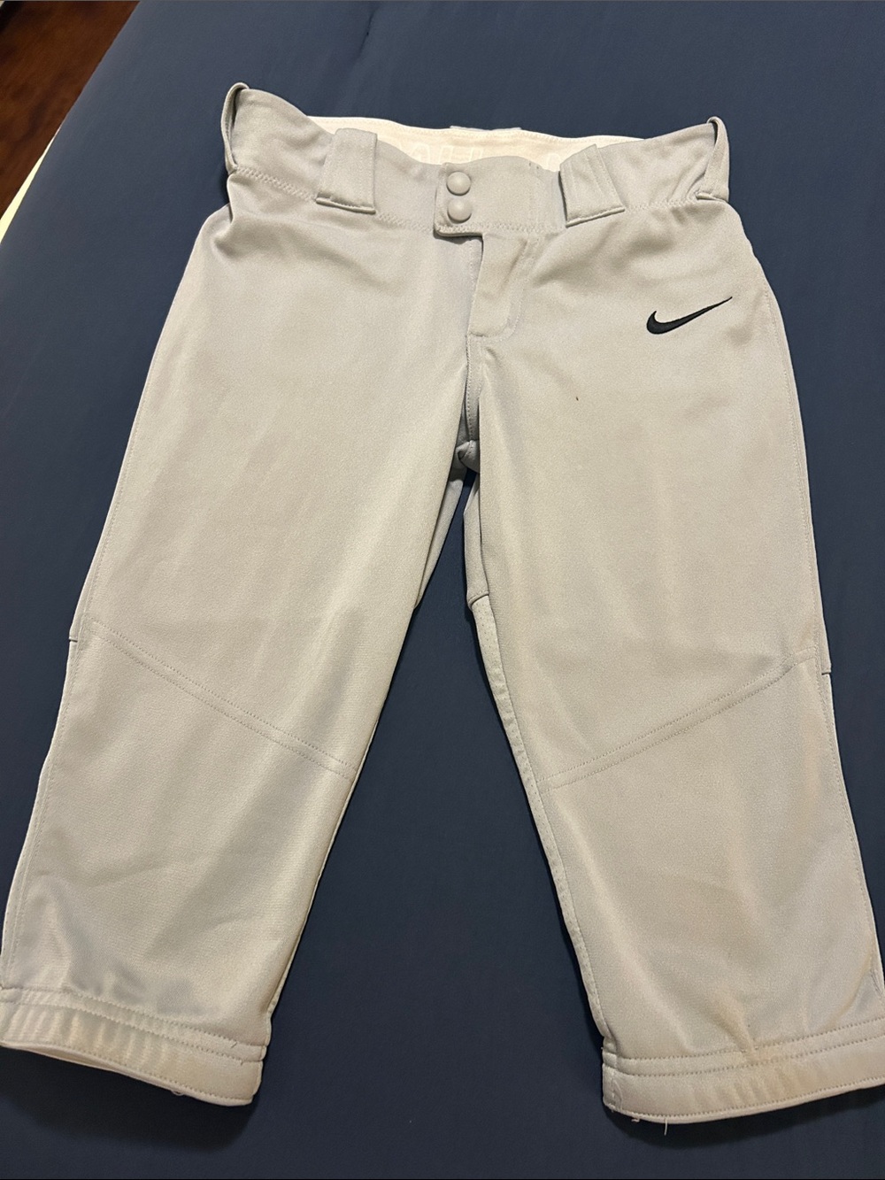 Nike Light Gray Kids' softball pants with Black Swoosh